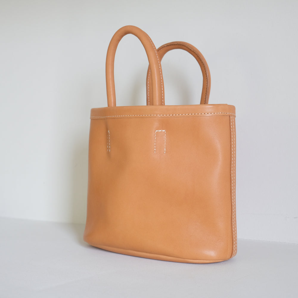 Leather oval basket bag mini Beige