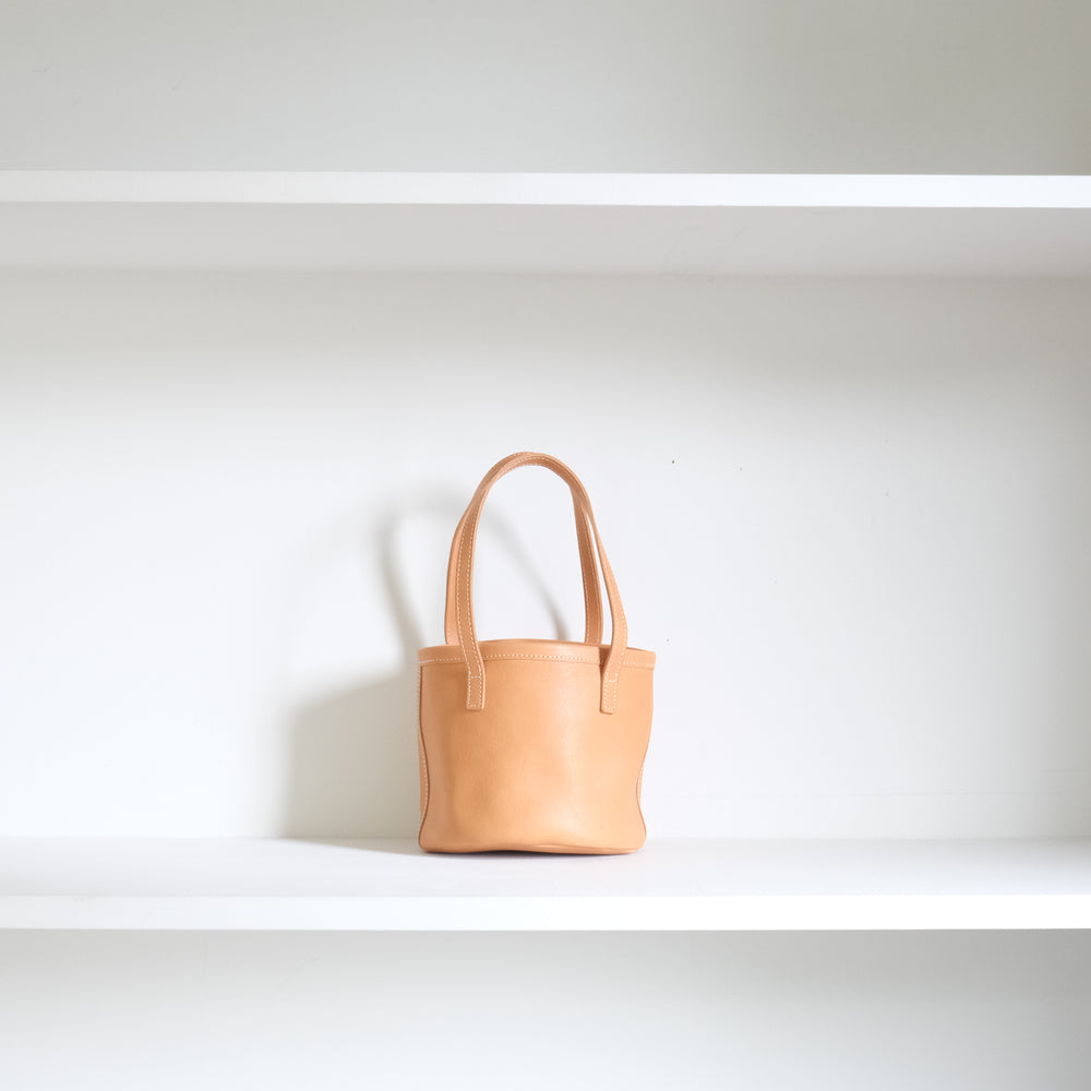 Leather round mini bag: long handles
