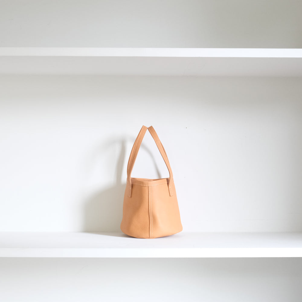 Leather round mini bag: long handles