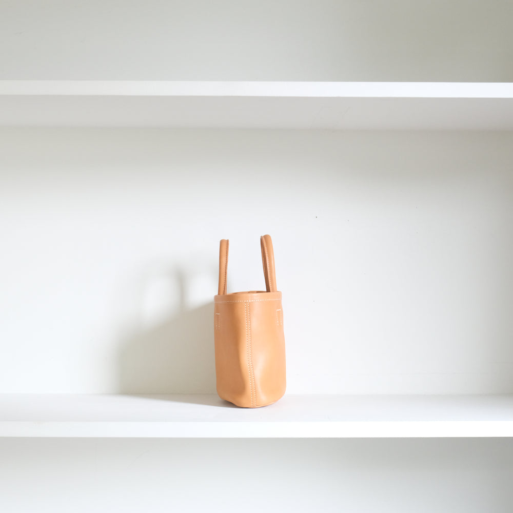 Leather oval basket bag mini Beige